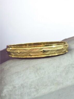Classic Gold-Tone Engraved Bangle Bracelet
936